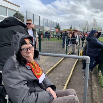 A man we support in Shared Lives at a football game